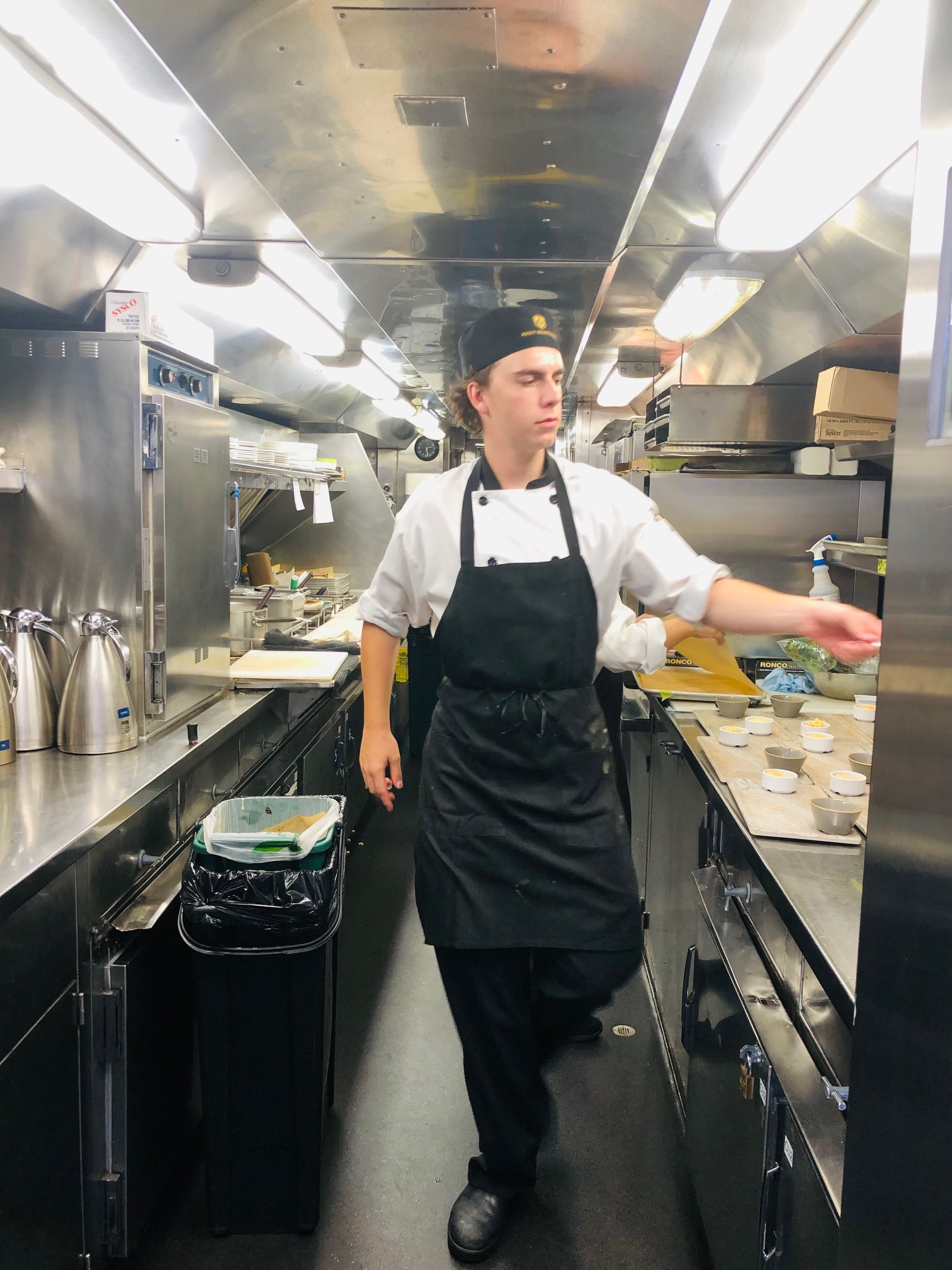 Chef and team work well together, even on a moving train.